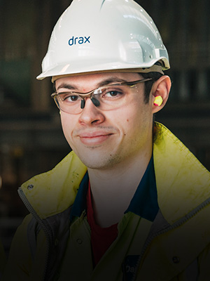 Photo of a male apprentice in a hard hat