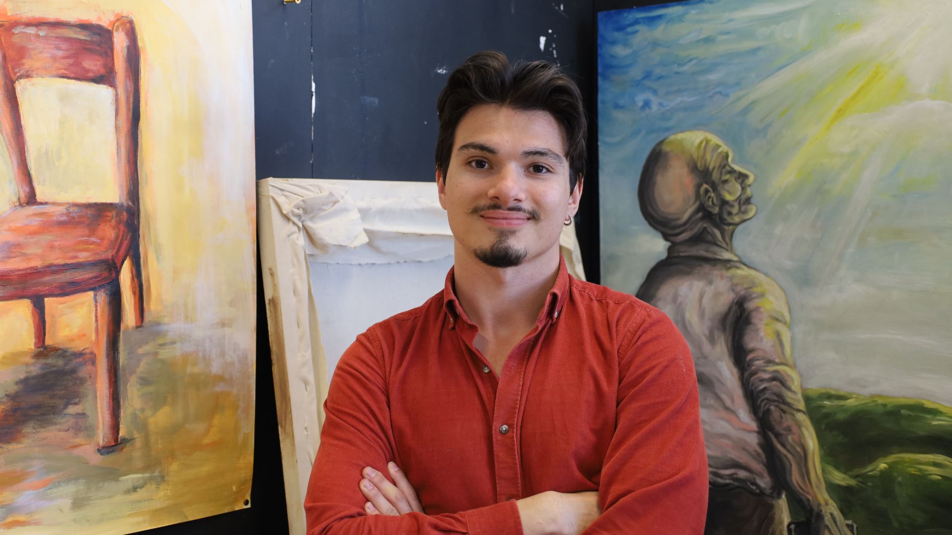 BA (Hons) Art & Design student, Burga, with his artwork at the end of year show at Selby College, 2025.