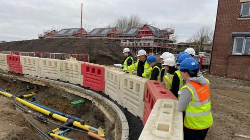 Construction Technical students at construction site 
