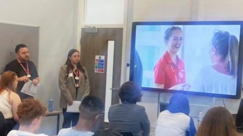 Travel and tourism students receiving a presentation 