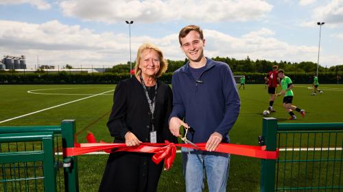 Sam Wright, CEO and Principal of the Heart of Yorkshire Education Group (left) and Keir Mather, MP for Selby (right) cutting the ribbon at the brand-new 3G pitch at Selby College.