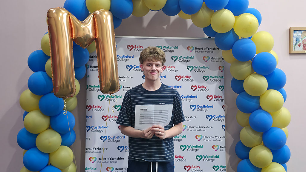 Student holding his results