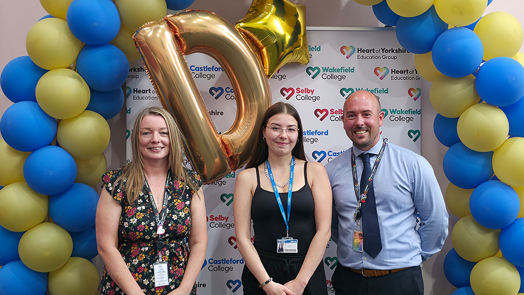 Student Wiktoria with staff members celebrating her results