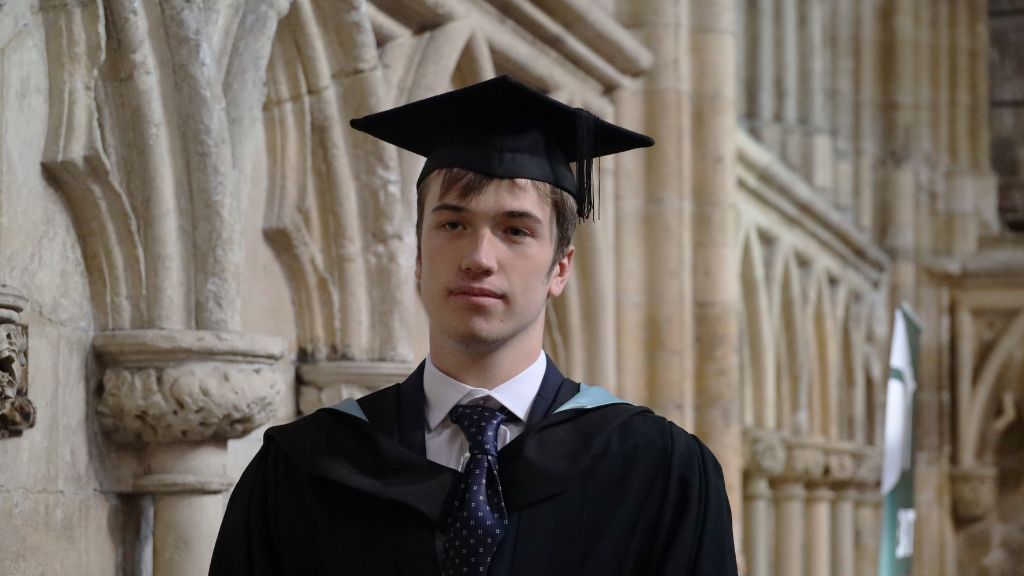 Student with cap and gown