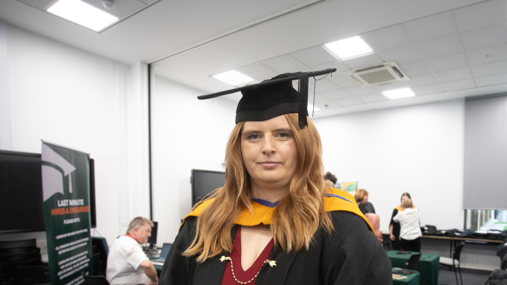 Photo of student wearing cap and gown