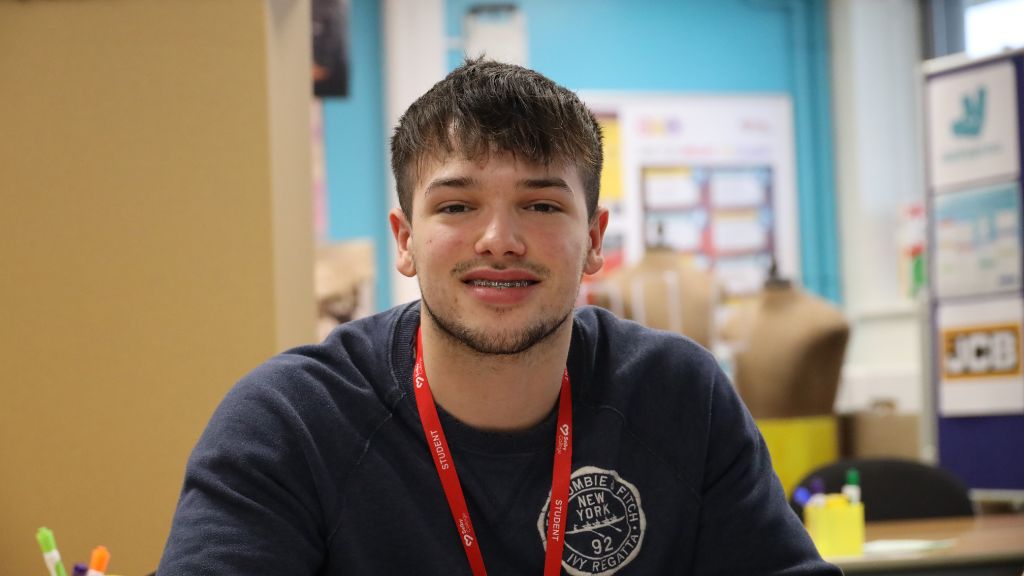 Student smiling in the classroom