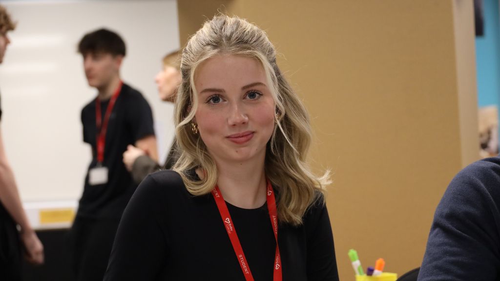 Student smiling in classroom