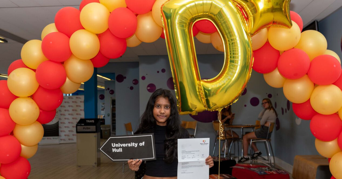 Student with A* balloon