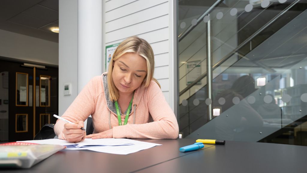Student studying in library