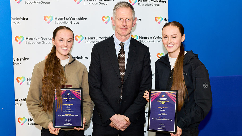 Students holding their awards