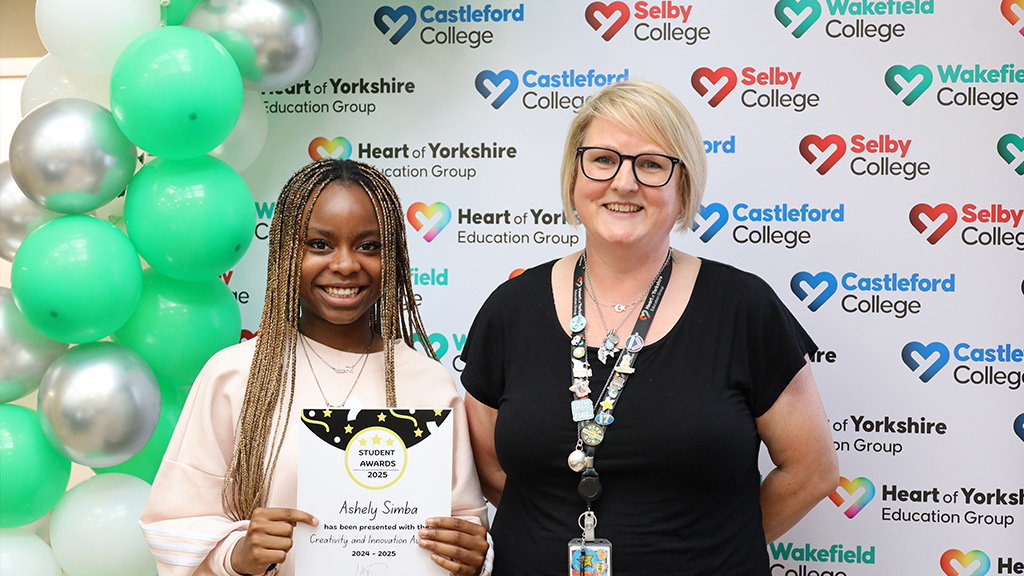 Student with their award stood next to tutor