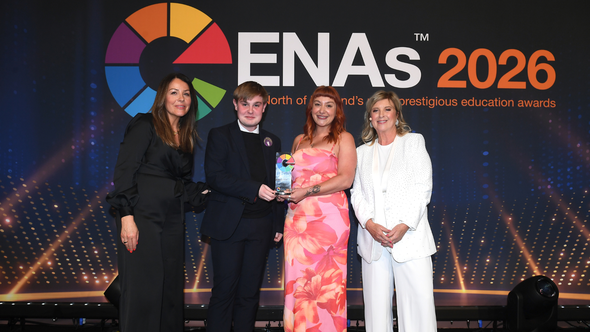 Student and lecturer holding award at Educate North Awards