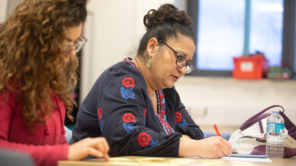 Students writing in classroom