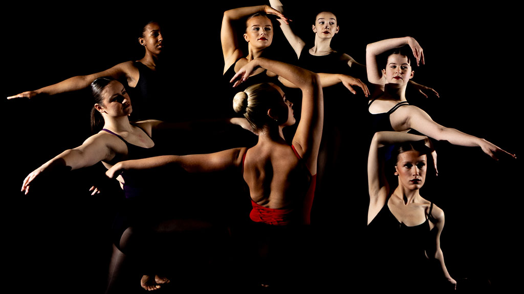 A group of dance students practicing in the studio